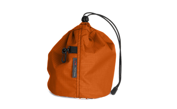 A Medium, clear-bottom Yarn Stuff Sack in Persimmon (dark orange with orange grid) 210 Cerylon.